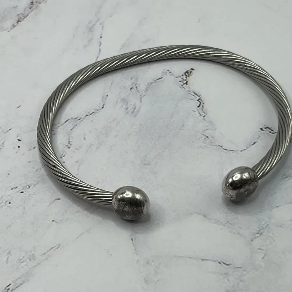 Set of 11 silver and gold tone bracelets